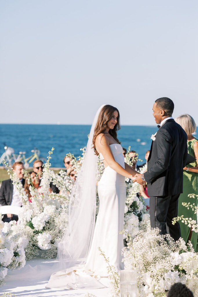 Bride and groom exchanging vows at The Theater on the Lake